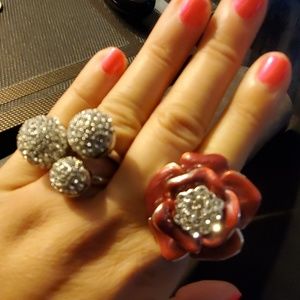 2 fashion rings, pink one is adjustable.  Silver